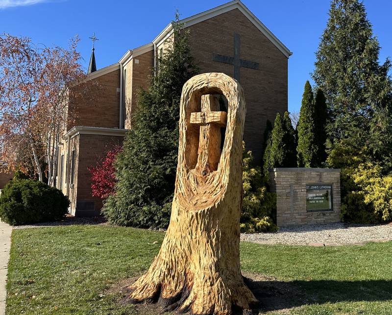A view of the finished cross that Bud Hainzinger of Morris carved n a tree stump at St. Johns Lutheran Church on Thursday, Nov. 9, 2023 in Peru. The family of Don and Ruth Johnson members of our church family who passed away donated the cost of getting this done in memory and honor of their parents.