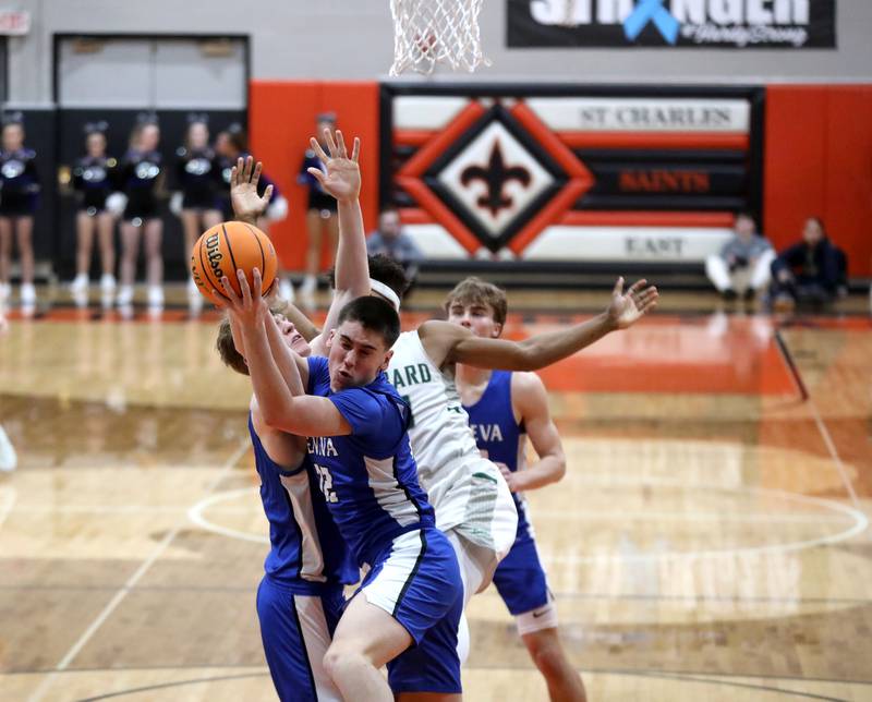 Geneva’s Benjamin Peterson brings down a rebound during the Class 4A St. Charles East Sectional final against Glenbard West on Friday, March 7, 2025 in St. Charles.