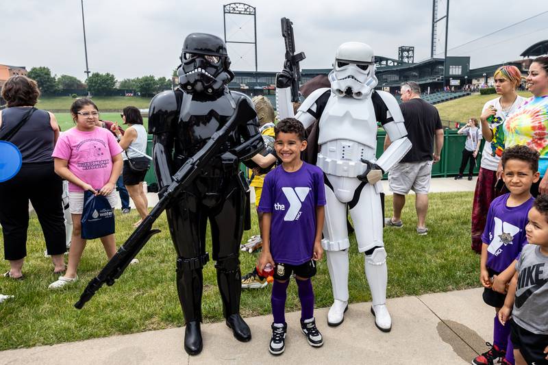 Crest Hill resident Cameron Betancourt takes a photo with a pair of Stormtroopers during Joliet Public Library's Star Wars Day event on June 7, 2025.