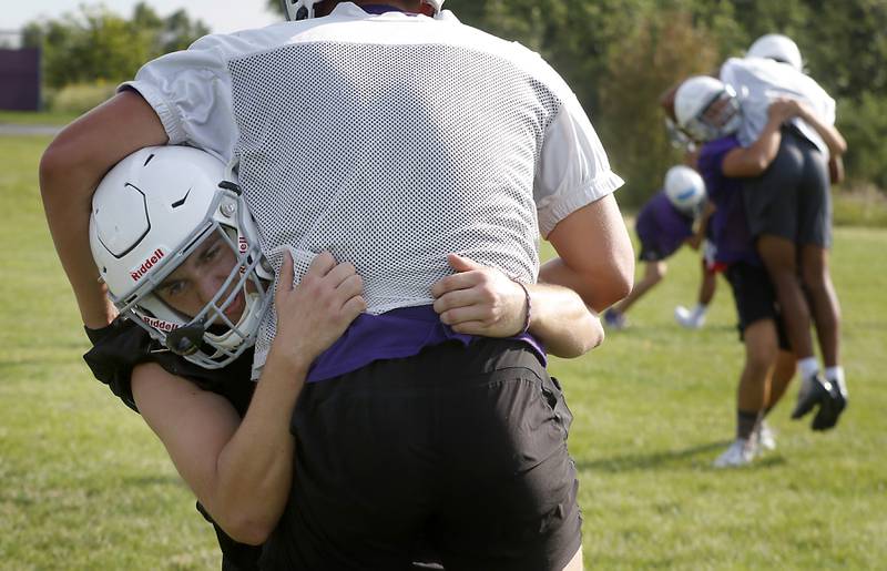 Hampshire’s Collin Kallhoff takes part in a tackling drill during the first day of football practice Monday, August 7, 2023, at the Hampshire High School.