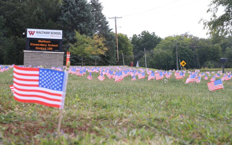 Waltham School placed 2,977 flags outside the school lawn to remember the lives lost in the 9/11 attacks on Thursday, Sept. 11, 2025 in Utica.