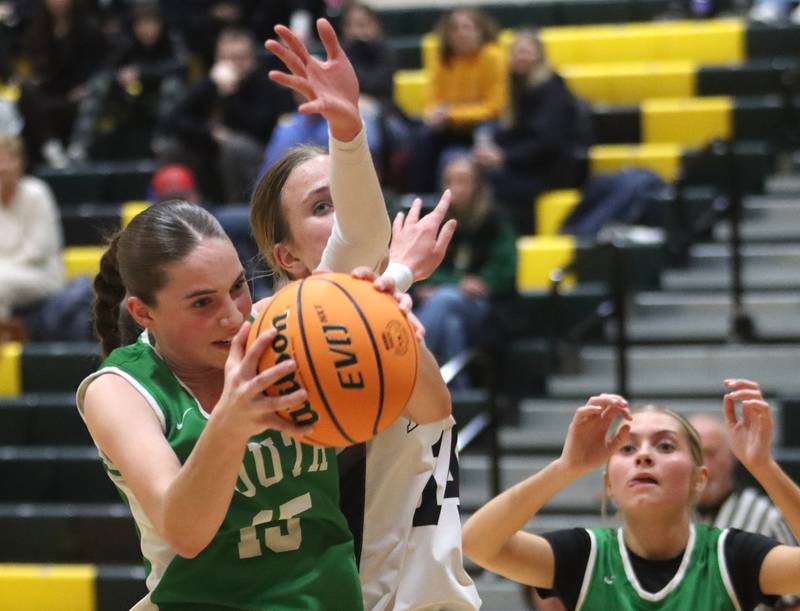 Crystal Lake South’s Tessa Melhuish, left, battles  Kaneland’s Grace Brunscheen in IHSA Class 3A Regional Title Game girls basketball action on Friday, Feb. 21, 2025, at Crystal Lake South High School in Crystal Lake.