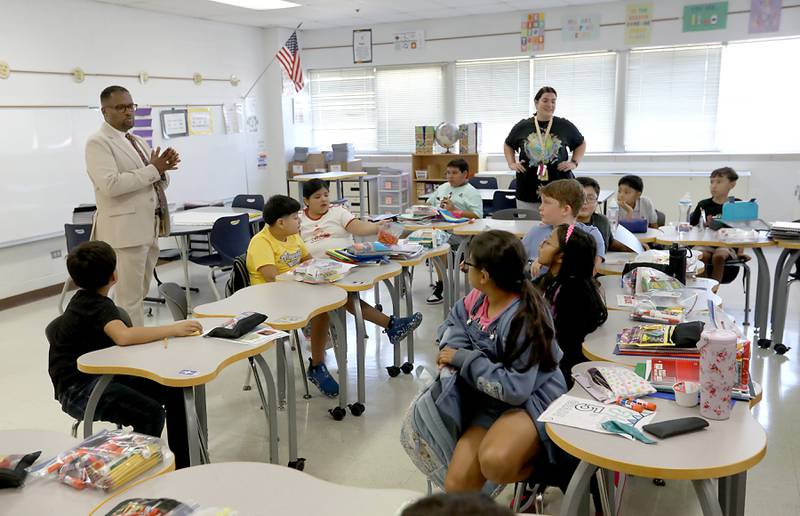 Harvard School District 50 Superintendent Brandon White visits with fifth grade students at Jefferson Elementary School during the first day of school on Wednesday, Aug. 13, 2025, in Harvard. White was previously was the superintendent of Cary School District 26.