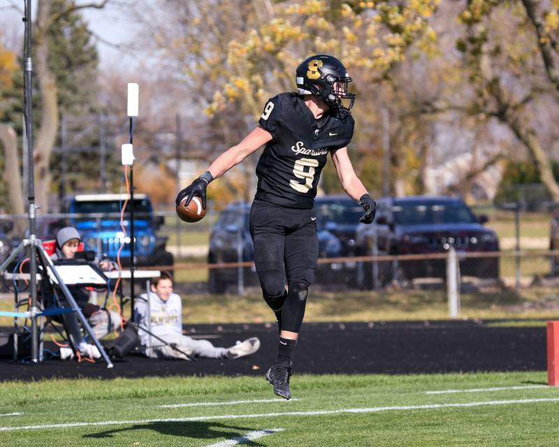 Sycamore's Caden O'Donnell (9) celebrates and looks to confirm the block punt he picked up and ran in for a touchdown counted during the class 5A playoff game on Saturday Nov. 2, 2024, while taking on Chicago Bulls College Prep held at Sycamore High school.