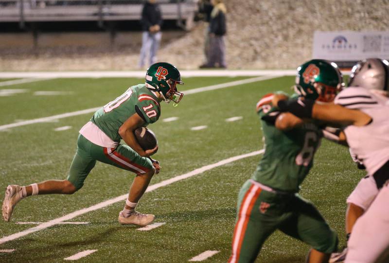 L-P backup quarterback Greyson Ernat runs the ball on one play against Kaneland on Friday, Oct. 17, 2025 at Howard Fellows Stadium.