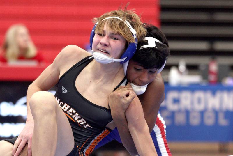 McHenry’s Myles Wagner, front, battles Dundee-Crown’s Chris Gerardo in a 126-pound bout in varsity wrestling at Carpentersville Thursday night.