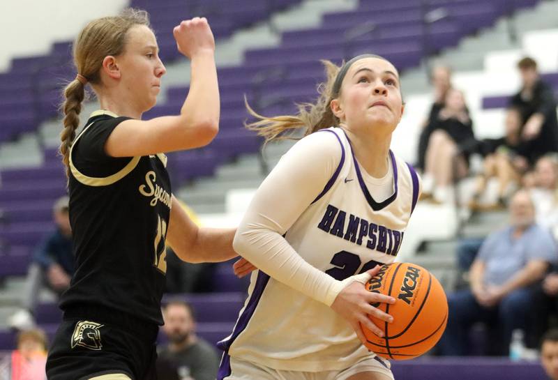 Hampshire’s Chloe Van Horn works under the hoop against Sycamore in varsity girls basketball on Friday, Jan. 3, 2025, at Hampshire High School in Hampshire.