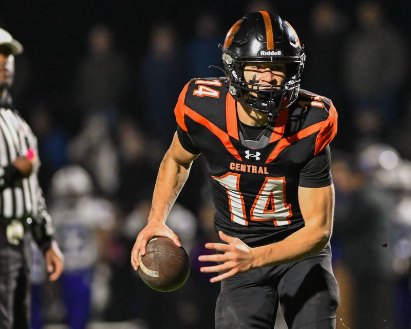 Crystal Lake Central's George Dimopoulos runs for yardage against Fox Valley Conference rival Hampshire on Friday, Oct. 20, 2023 in Crystal Lake.