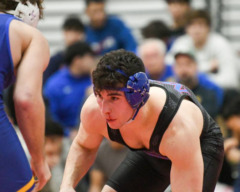 Anthony Haddad, right, of Marmion Academy keeps an eye on Wyatt Hochgraber of Sandburg in the 165-weight class during the regional meet on Tuesday Feb. 25, 2025, held at Yorkville High School.