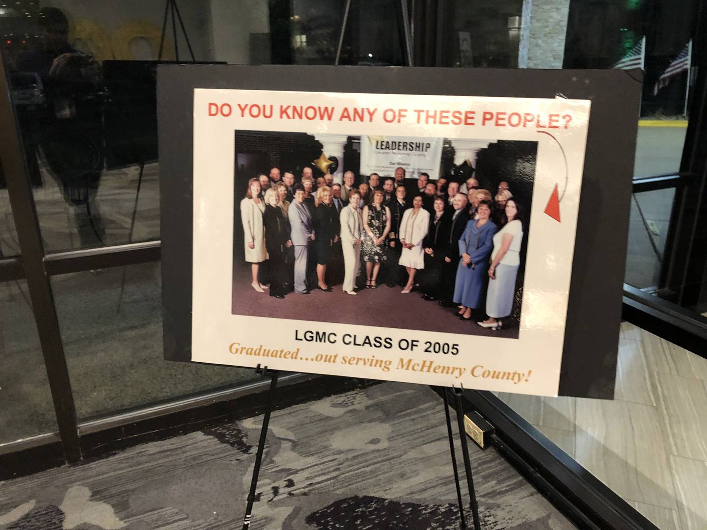 A board with a photo of the 2005 LGMC class at the Leadership Greater McHenry County 20th anniversary celebration Oct. 17, 2024.