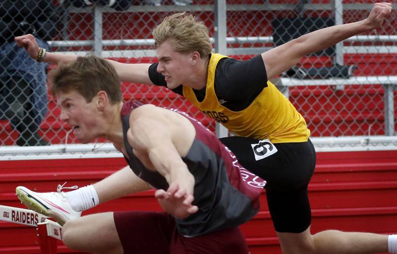 Jacob’s Carson Goehring (right) chases down  Prairie Ridge’s Keel Brossard to win the 110 meter high hurdles during the Fox Valley Conference Boys Track and Field Meet on Thursday, May 9, 2024, at Huntley High School.