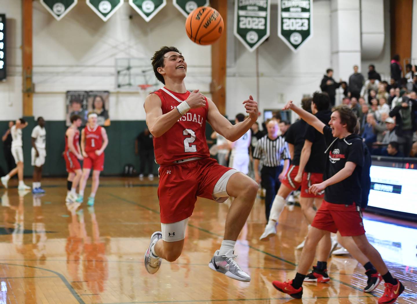 Hinsdale Central’s Dillon Orozco (2) flips the ball backwards over his head as the buzzer sounds ending a win over Glenbard West on January 31, 2025 at Glenbard West High School in Glen Ellyn.