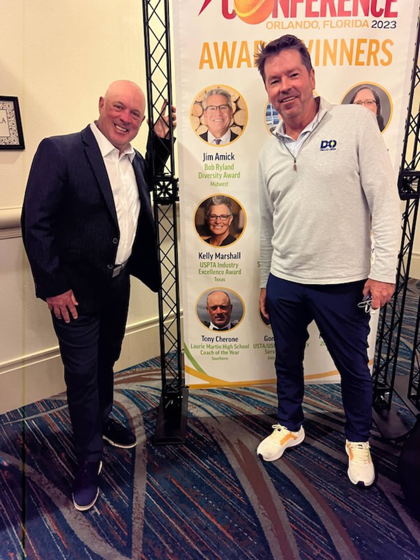 Tony Cherone (left), a 1988 McHenry East graduate, recently received a national coaching award from the United States Professional Tennis Association.