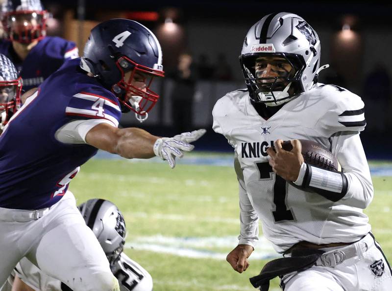 Kaneland's Jalen Carter gets just past Belvidere North's Ben Bucher Friday, Nov. 7, 2025, during their Class 5A second round playoff game at Belvidere North High School.