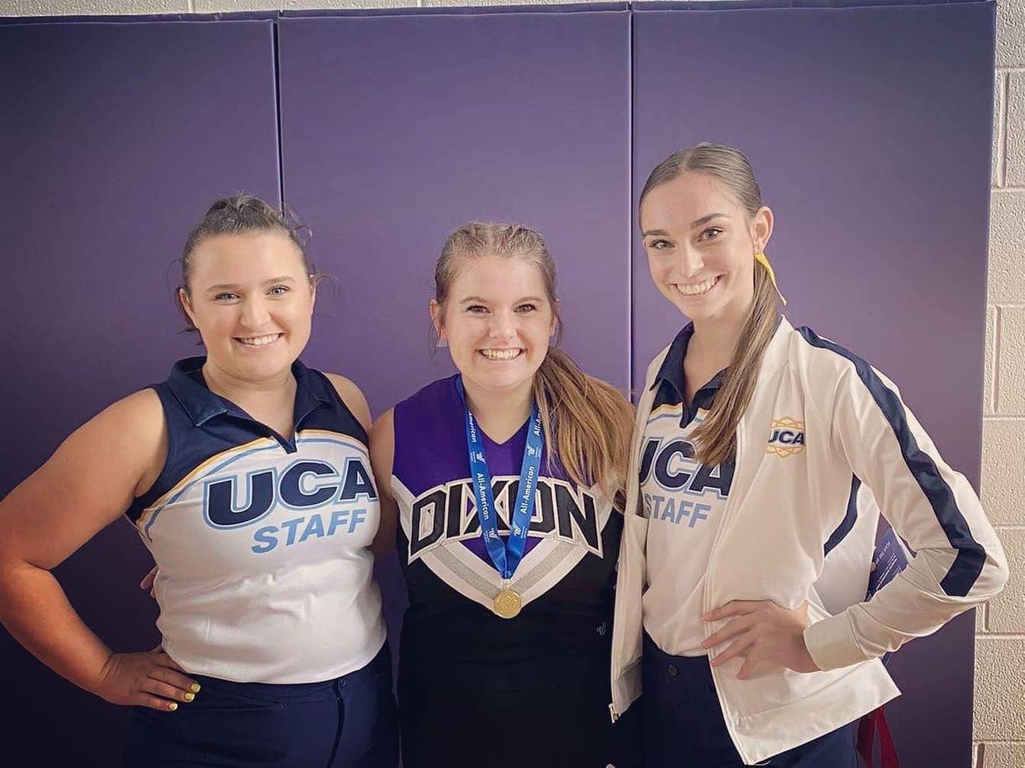 Bree Covell, center, appears with two evaluators from the Universal Cheer Association camp. Covell is a Dixon High School cheerleader who was selected to take part in the Pearl Harbor Memorial Parade as part of the Varsity Spirit All-America squad.