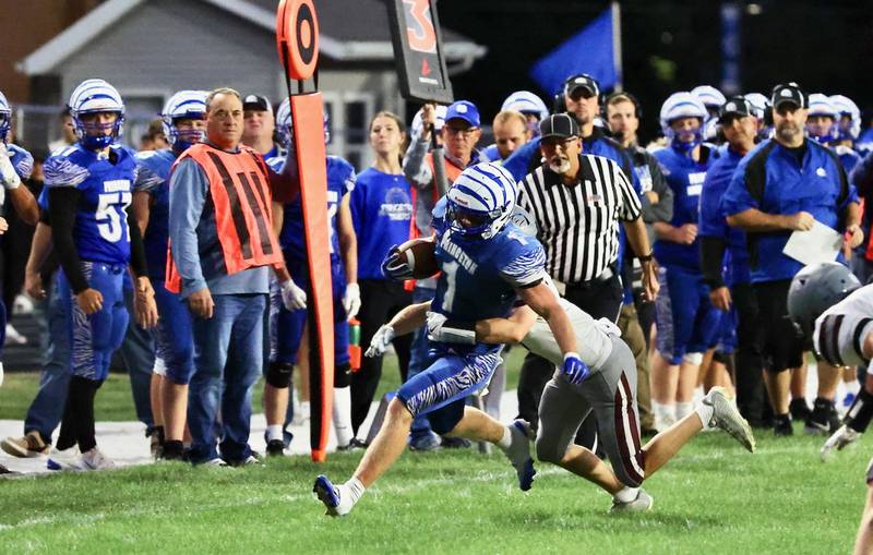 Princeton's Casey Etheridge tries to shrug off a Rockridge defender Friday night at Bryant Field.