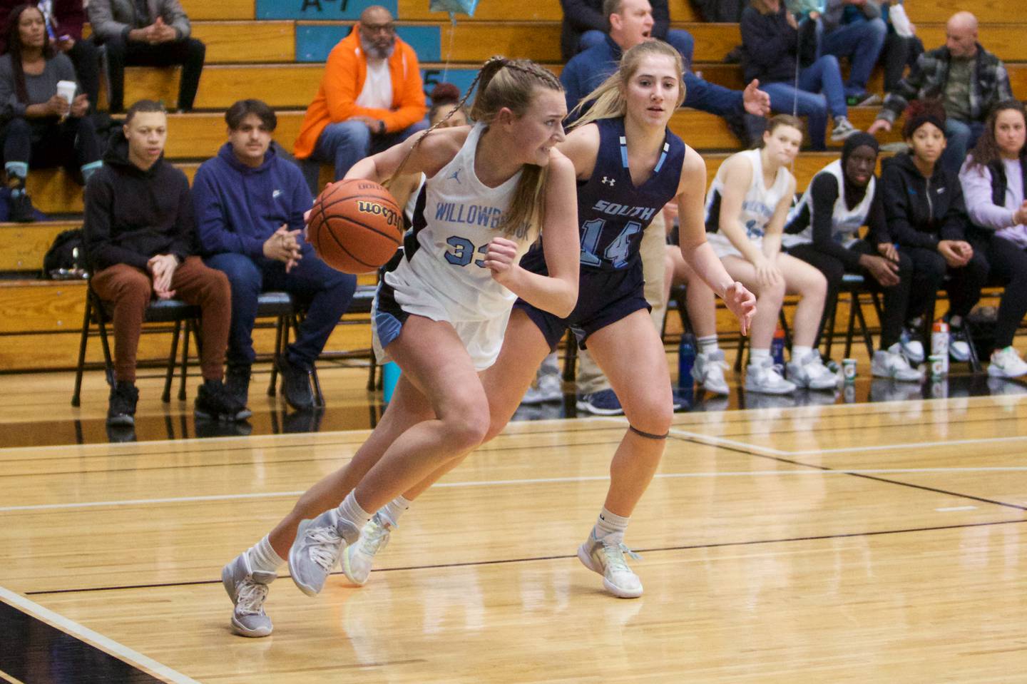 Willowbrook's Elle Bruschuk looks to advance the ball against Downers Grove South's Allison Jarvis on Friday, Feb.3,2023 in Villa Park.