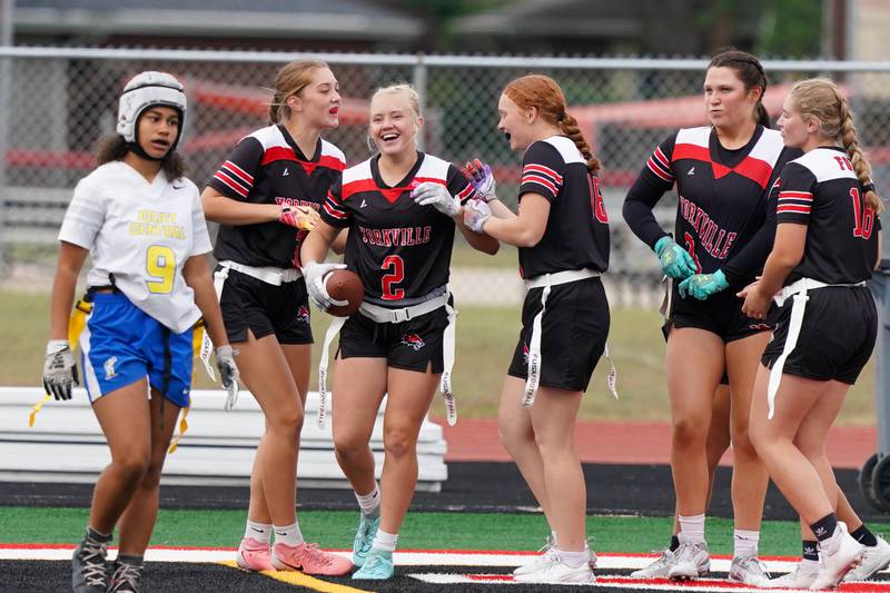 Yorkville's Brooke Ekwinski (2) smiles after scoring a touchdown against Joliet Central during a flag football game at Yorkville High School on Monday, Sep 23, 2024.