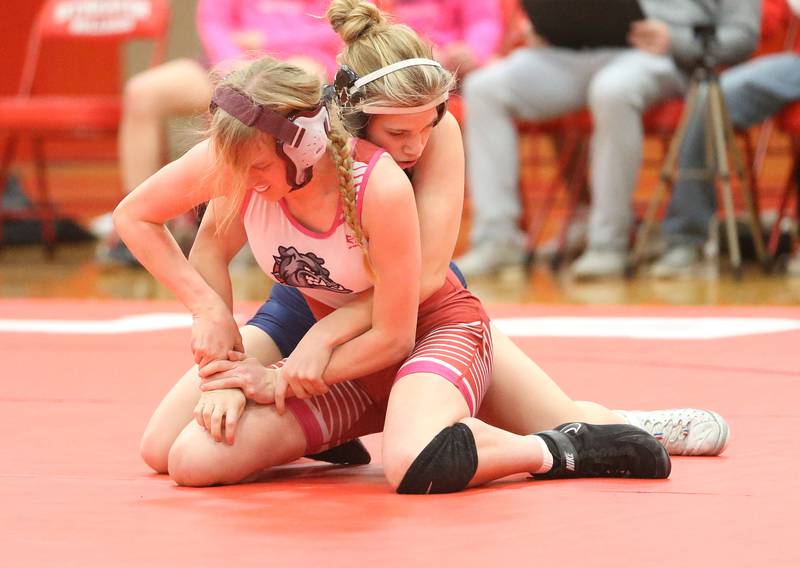 Streator's Olivia Brandenburg (in front) tries to escape the hold of Lisle's Sophie Crescenzo on Wednesday, Jan. 21, 2026, at Streator.