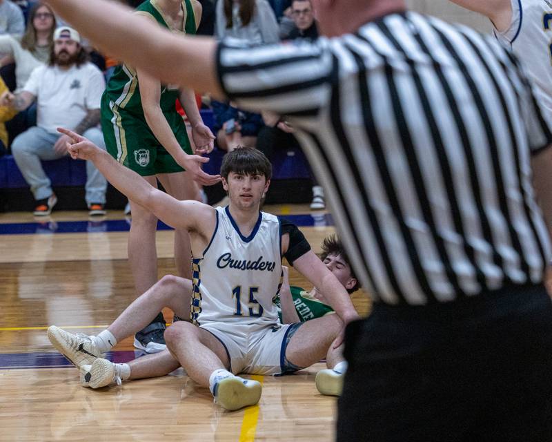 Marquette's Alec Novotney (15) reacts whilst awaiting officials call during the Class 1A Regional Boys Basketball Championship game on Friday, Feb. 27, 2026 at Serena High School.