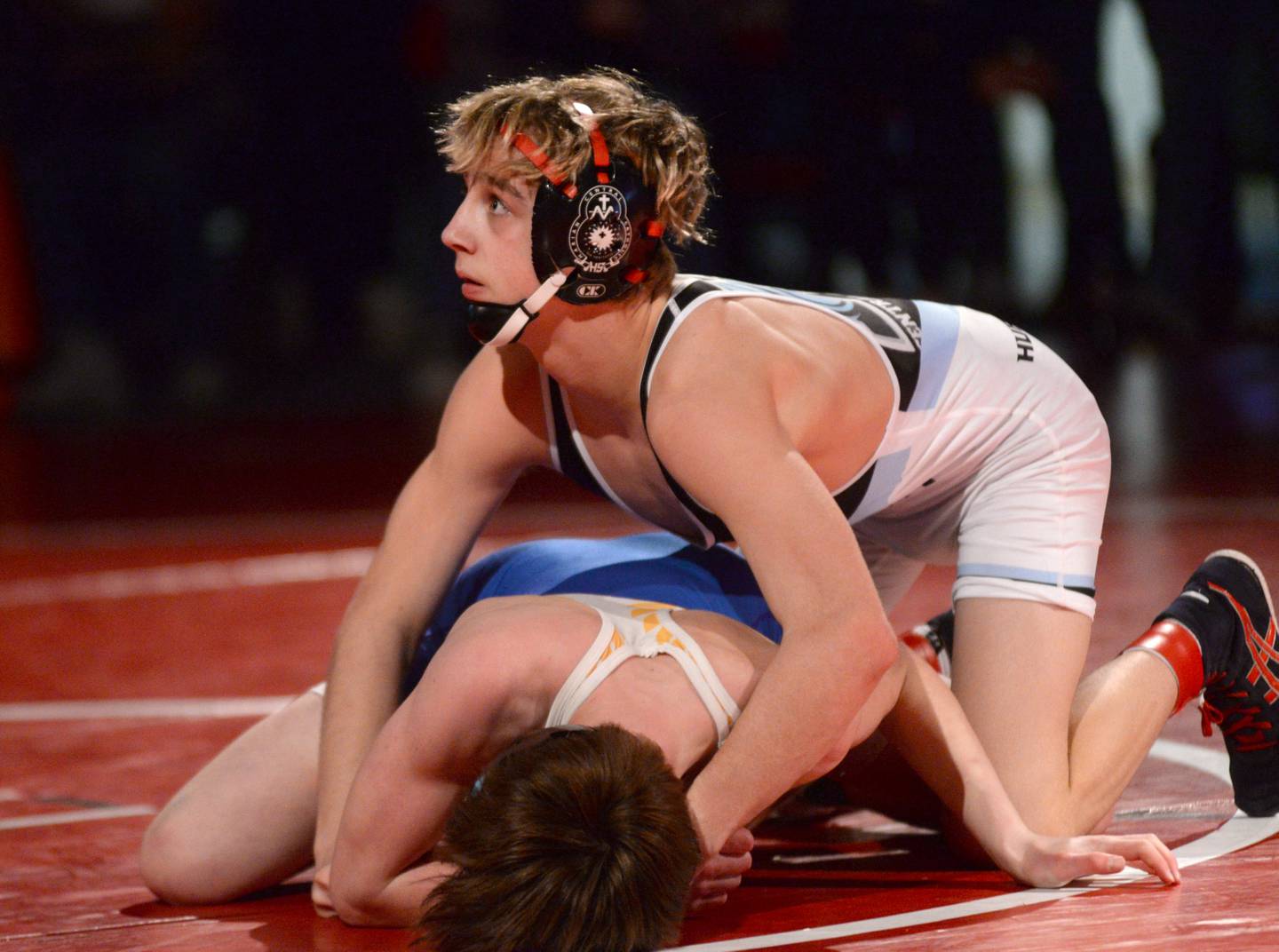 Woodstock Marian’s Austin Hagevold (top) and Johnsburg’s Chase Vogel wrestle at 113 pounds in the finals at the 1A Oregon Regional on Saturday, Feb. 15, 2025.