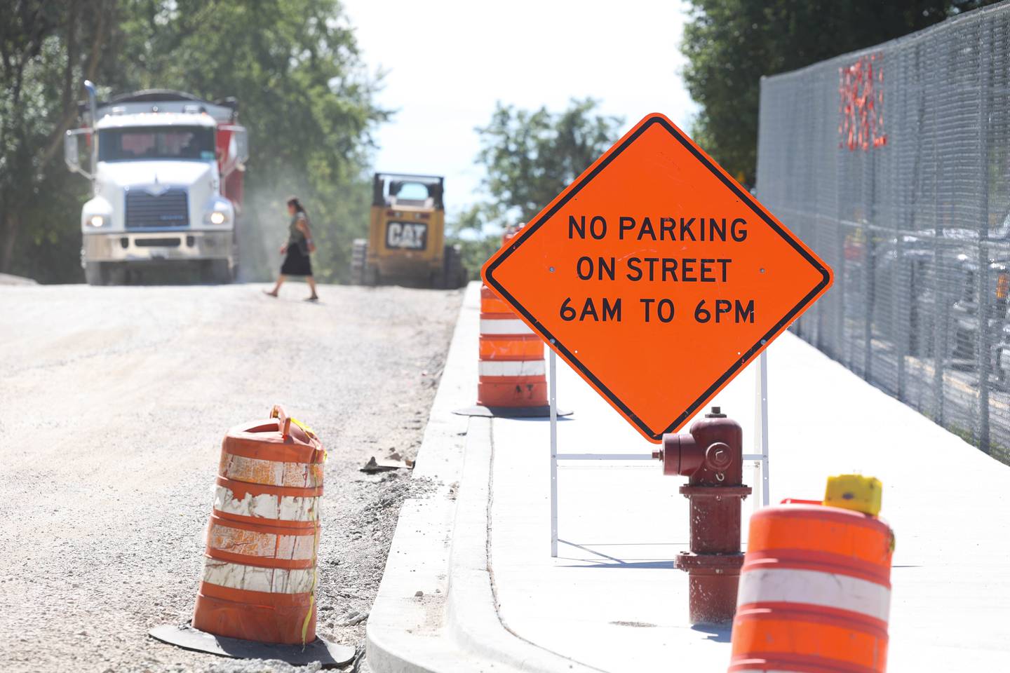 A sign is posted at Harwood Avenue between Cass Street and Sterling Avenue as resurfacing is underway. Saturday, Sept. 3, 2022, in Joliet.