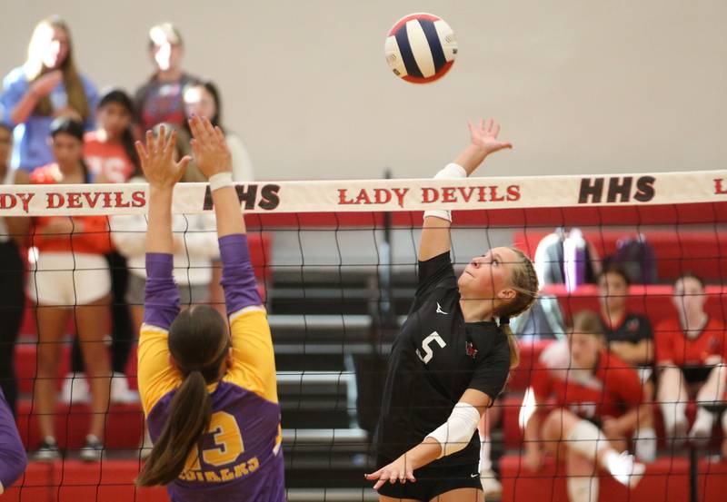 Hall's Charlie Pellegrini spikes the ball past Mendota's Ella Martin on Tuesday, Sept. 13, 2024 at Hall High School.