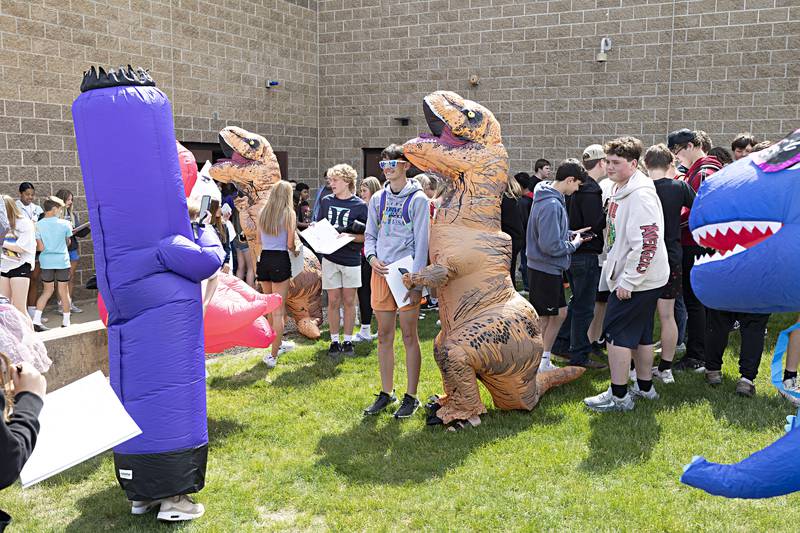Students were tracked down for pictures by a menagerie of figures as they looked for friends to sign their yearbooks amid the chaos on Thursday, May 25, 2023.