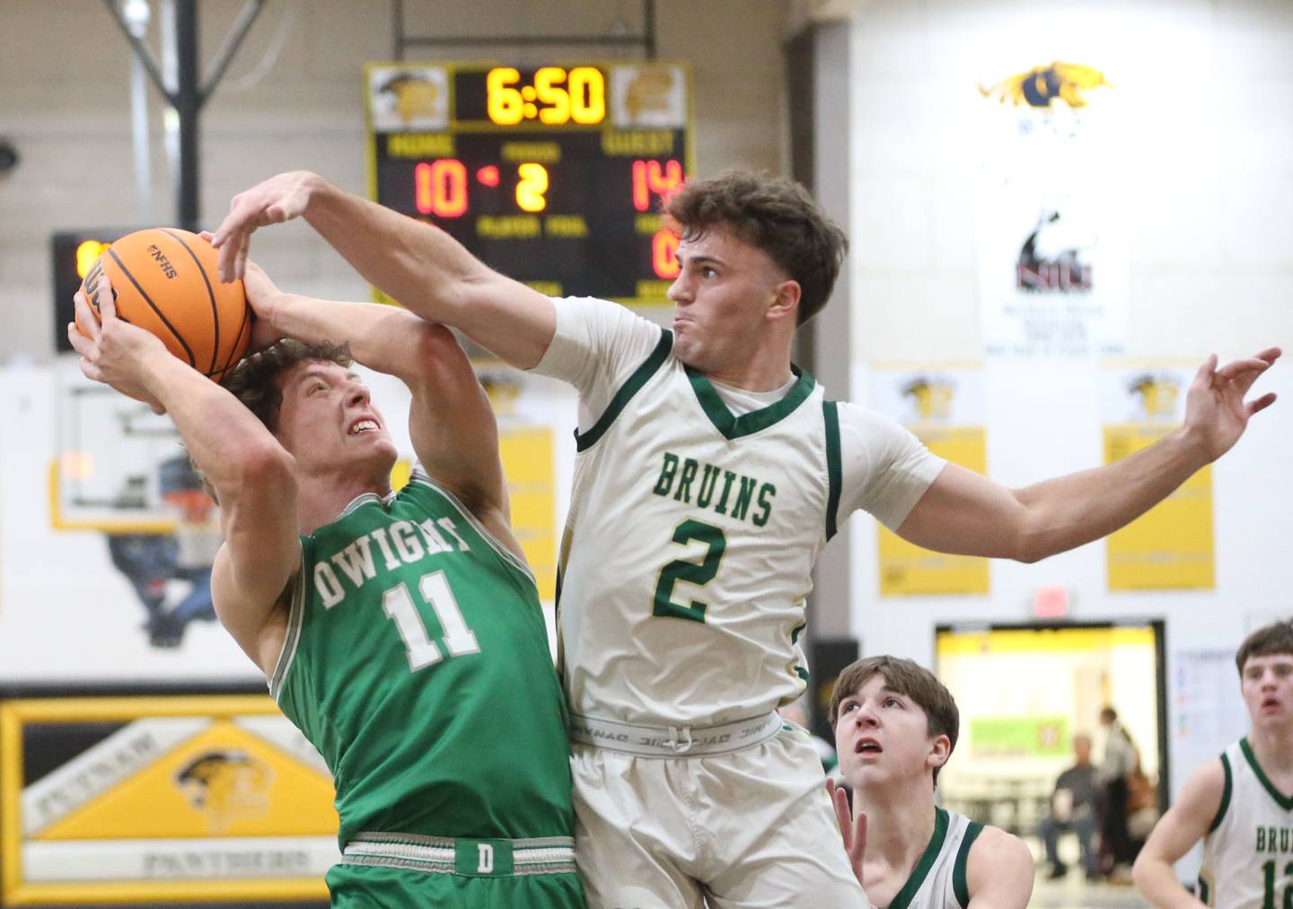 Dwight's Joey Starks eyes the hoop as St. Bede's Guss Burr defends during the Tri-County Conference Tournament on Tuesday, Jan. 27, 2026 at Putnam County High School.
