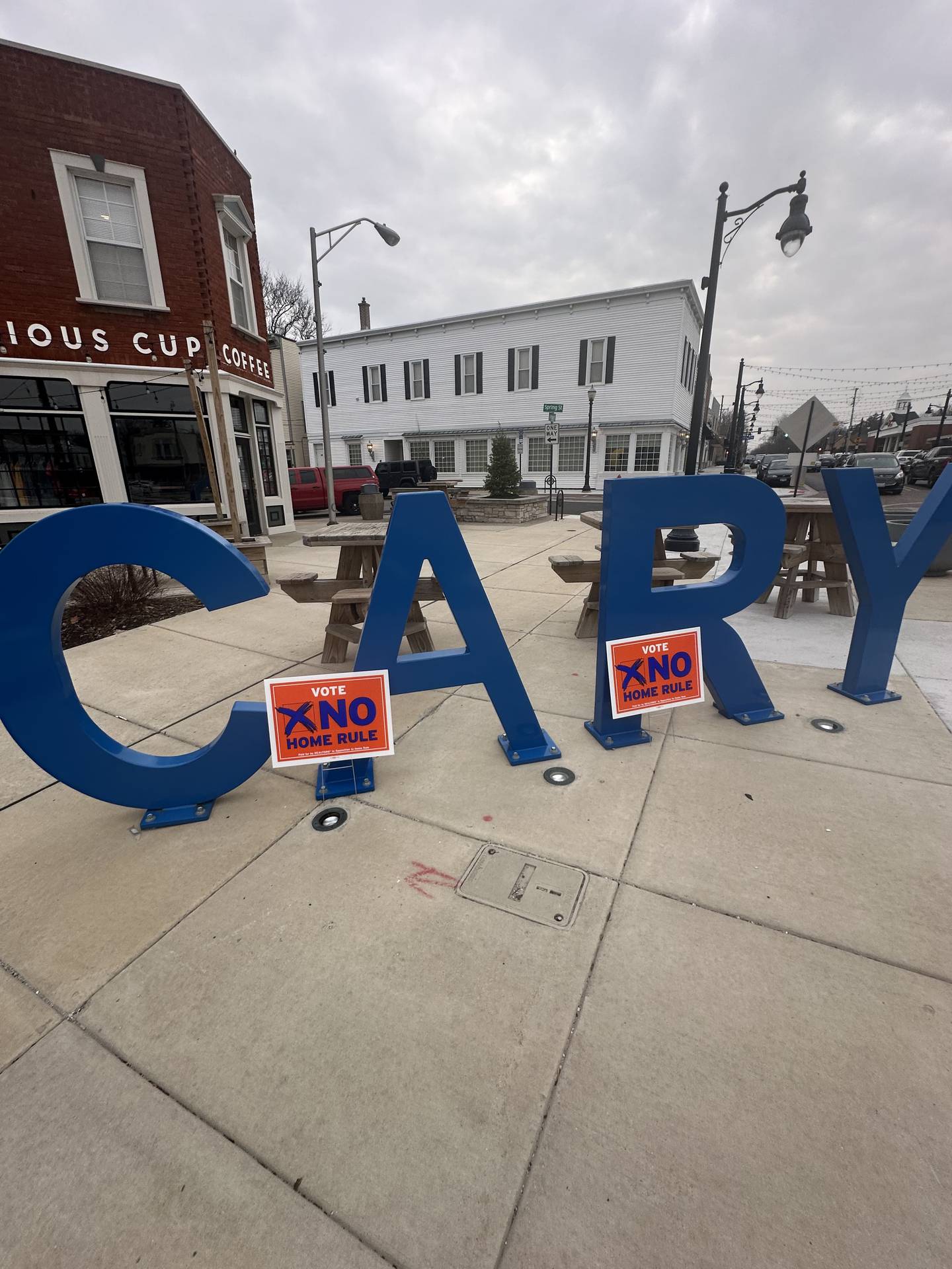 "Vote no home rule" placards are posted on an iconic sign in downtown Cary.