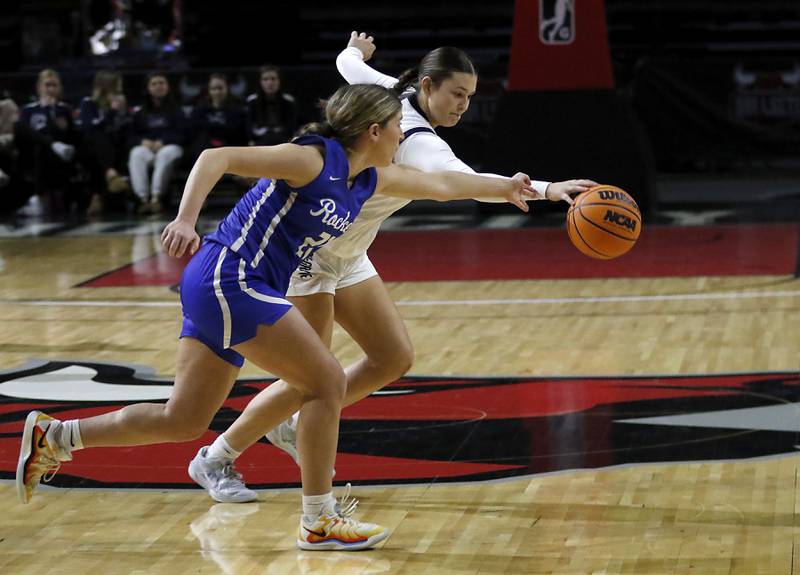 Burlington Central's Alison Kowall and Cary-Grove's Avery Stortz battle for a loose ball during a Fox Valley Conference basketball game  on Tuesday, Jan. 14, 2025, at Now Arena in Hoffman Estates.