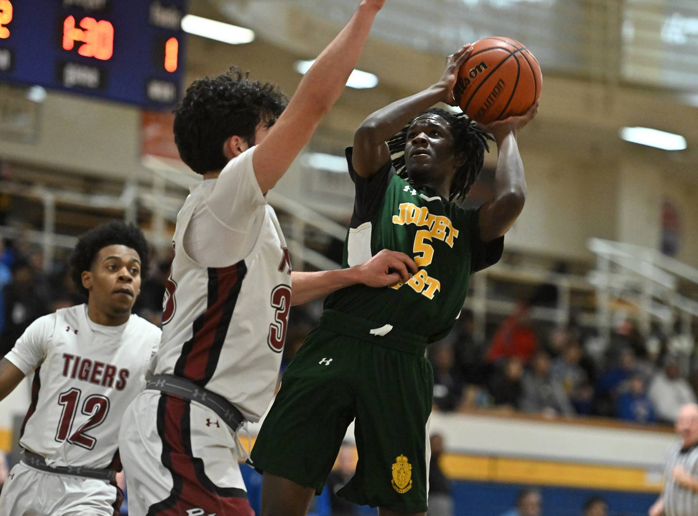 Joliet Central's Deven Triplett goes up strong for a jump shot  during a conference game againast Plainfield North on Friday, Jan. 19, 2024, at Joliet. (Dean Reid for Shaw Local News Network)