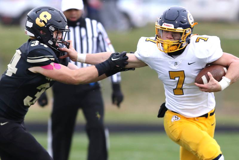 Sterling's Kael Ryan stiff arms Sycamore's Joey Puleo during their Class 5A state playoff game Saturday, Nov. 12, 2022, at Sycamore High School.