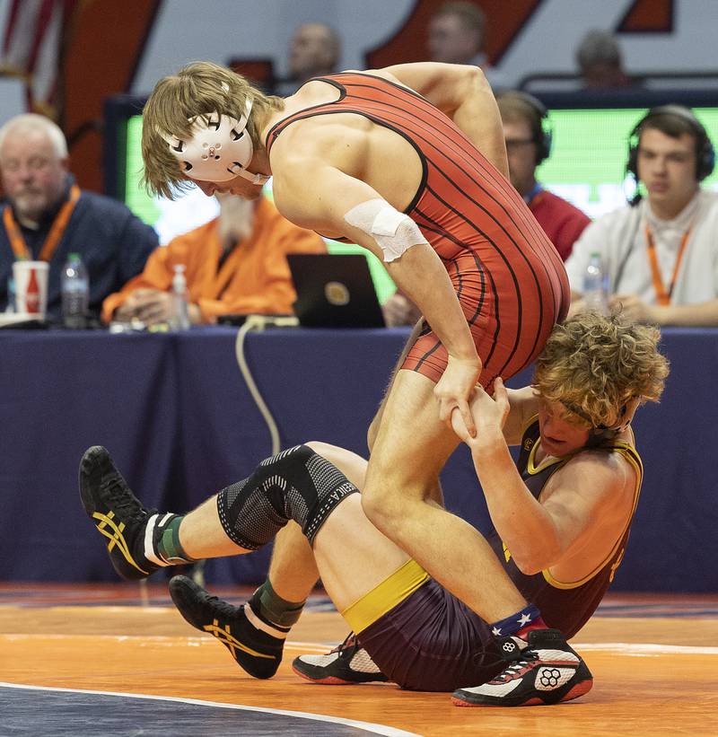 Montini’s Kam Luif (right) and Rockford East’s Donald Cannon compete in the 138 pound weight class of the 2A state individual wrestling finals Saturday, Feb. 22, 2025, at State Farm Center in Champaign.
