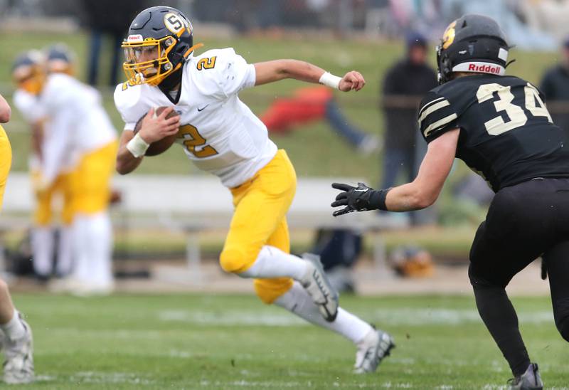 Sterling's JP Schilling runs past Sycamore's Joey Puleo during their Class 5A state playoff game Saturday, Nov. 12, 2022, at Sycamore High School.