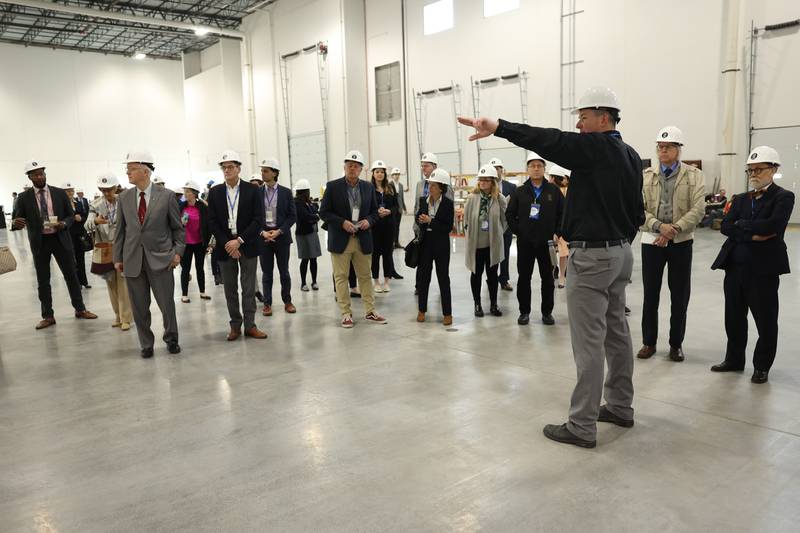 Lion Electric vehicle manufacturing facility General Manager Eric Pansegrau gives a tour during a press conference and interactive tour the new manufacturing facility.. Monday, Mar. 21, 2022, in Joliet.