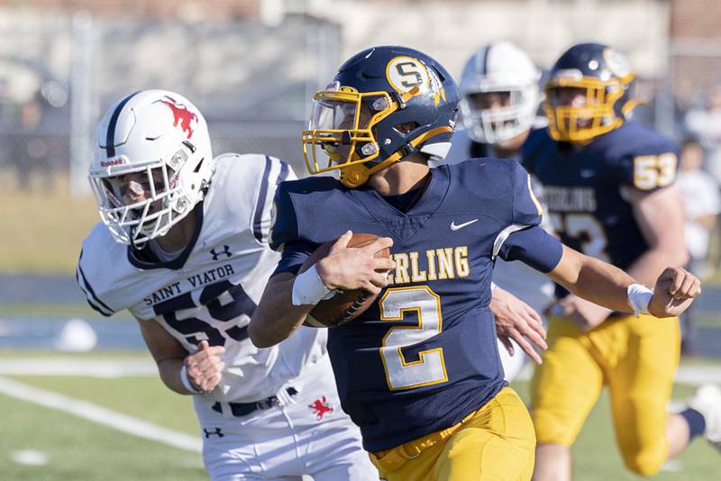 Sterling’s JP Schilling picks up big yards in the first half of the Warriors’ first round playoff game Saturday, Oct. 29, 2022 against St. Viator.