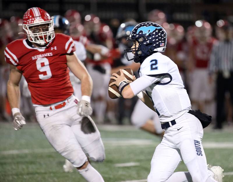 Downers Grove South's Will Potter (2) looks for an open receiver Friday October 27, 2023 in Naperville.