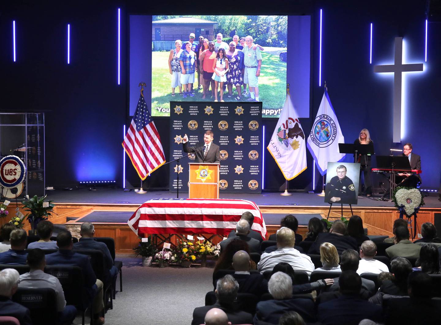 Daniel Scott, son of DeKalb County Sheriff Roger Scott, speaks during the memorial service for the former sheriff Friday, March 7, 2025, at Bethany Road Bible Church in DeKalb. Scott, who was the county sheriff for 36 years, died on February 23 at the age of 78.