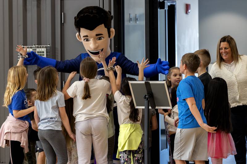 Dixon Park District mascot SPARK greets kids from St. Anne’s School Tuesday, Jan. 31, 2023 as they enjoy an afternoon of activity.