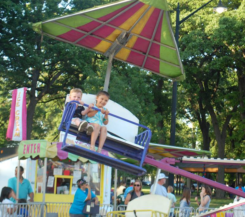 Children soar above the crowds Friday, May 26, 2023, at Streator Park Fest on the south side of City Park.