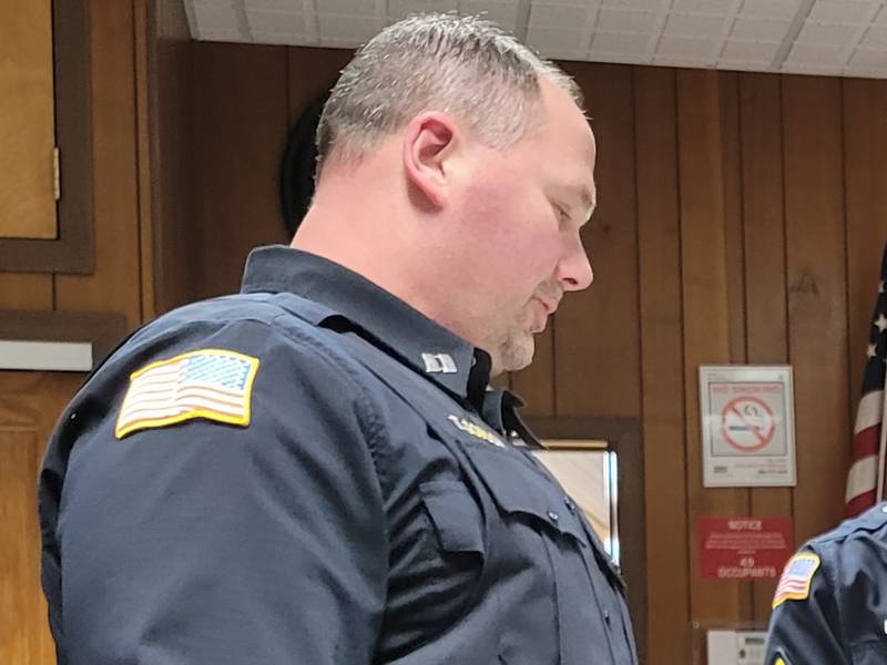 Marseilles Police Capt. Todd Gordon (left) reads the credit of officers James Buckingham (middle) and Mike Byrd as part of their promotion to the rank of  sergeant, part of the Marseilles City Council meeting on Wednesday.