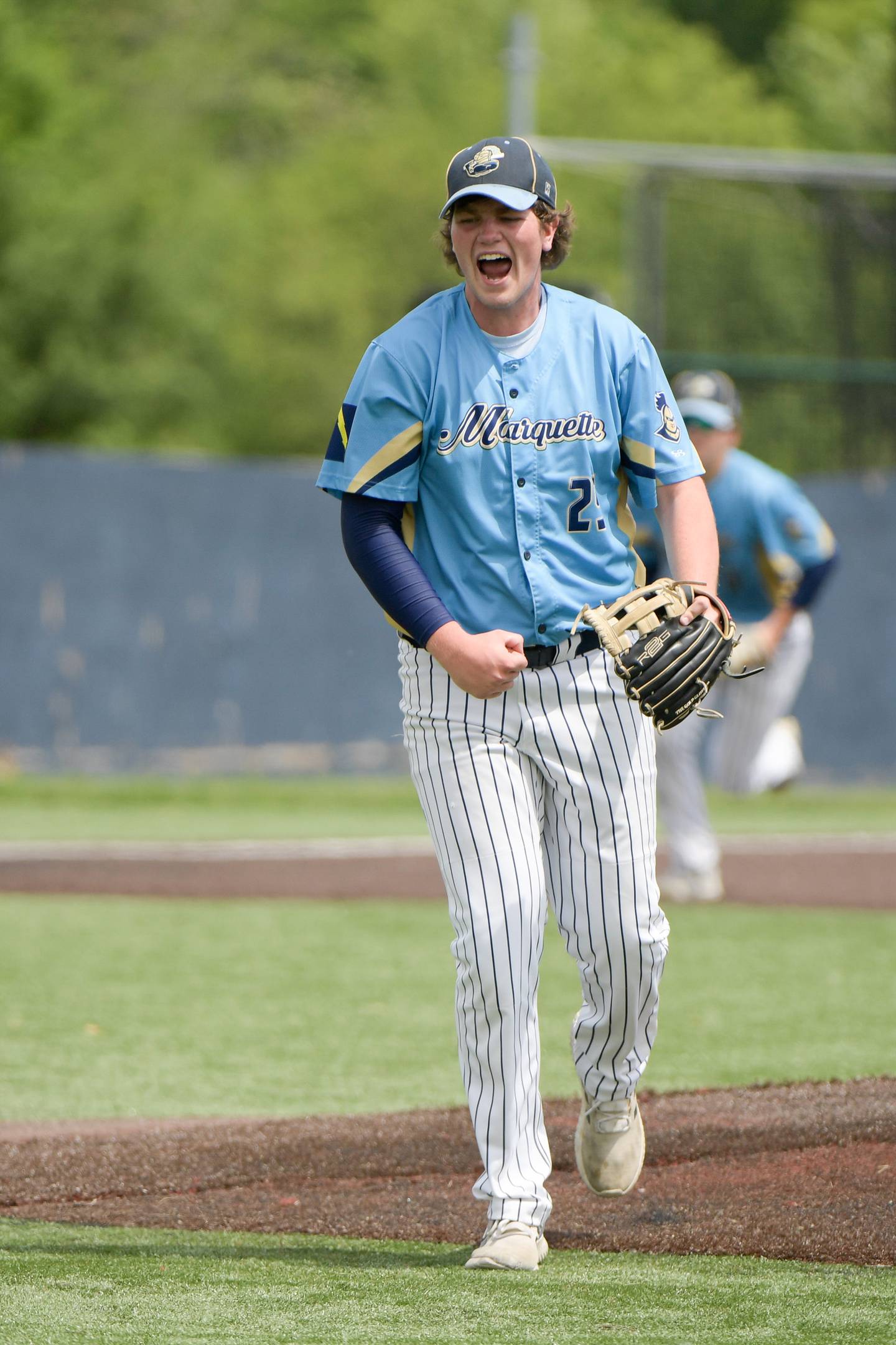 Marquette's Aiden Thompson (25) celebrates retiring the side during the fourth inning of the 1A Harvest Christian Sectional at Judson College in Elgin on Saturday, May 28, 2022.