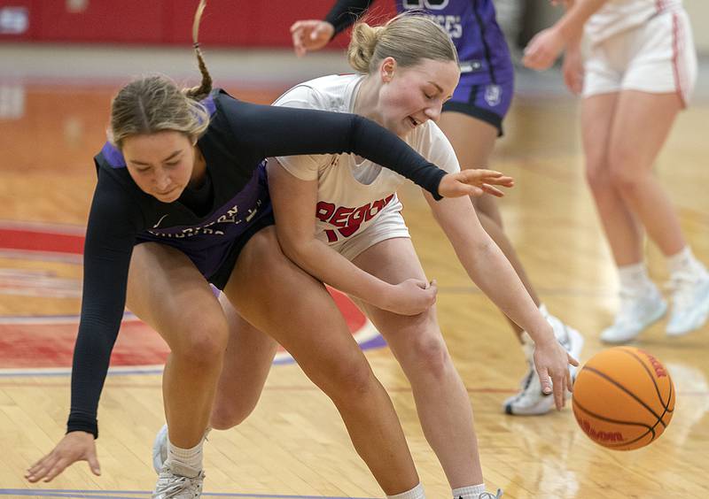Dixon's Reese Dambman and Oregon’s Shaylee Davis collide while going for a ball Thursday, Jan. 16, 2025, at the Blackhawk Center in Oregon.