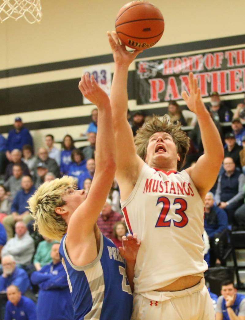 Morrison's Carson Strating eyes the hoop as Princeton's Noah LaPorte defends during the Class 2A Regional final game on Friday, Feb. 23, 2024 at Erie-Prophetstown High School.