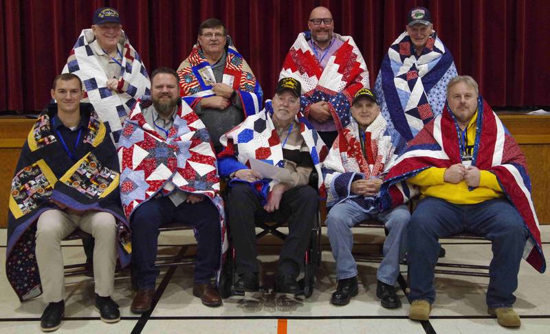 The 4 p.m. Quilts of Valor Presentation recipients are (back row, from left) Ron Bengtson, Tom Nink, Bobby Chapman, Robert Miller, (front row) James Ramsyer, Mark Fulkerson, Todd Stephens, Bob Babczak, and Bob Babczak Jr.