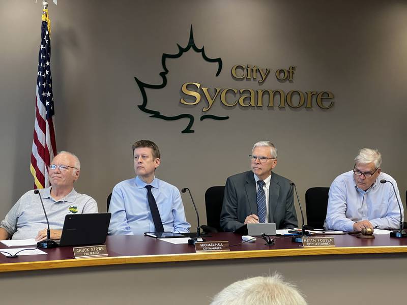 Sycamore 2nd Ward Alderperson Chuck Stowe, City Manager Michael Hall, City Attorney Keith Foster and Mayor Steve Braser attend a City Council meeting on Sept. 3, 2024, and listen to a city official speak about a recent hiring decision.
