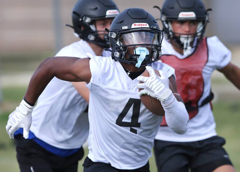 Sycamore’s Tyler Curtis carries the ball during practice Monday, Aug. 7, 2023, at Sycamore High School.