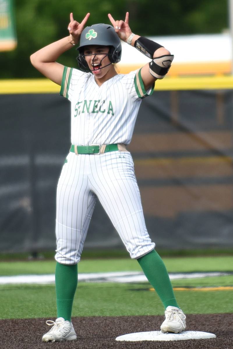 Seneca's Aurora Weber gestures to the dugout after hitting a double in the Class 2A Seneca Regional semifinals against Reed-Custer Tuesday, May 19, 2026.