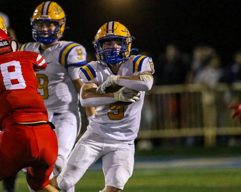 Lyon's Danny Caroll (5) looks for running room during football game between Hinsdale Central at Lyons.  Sept 8, 2023.